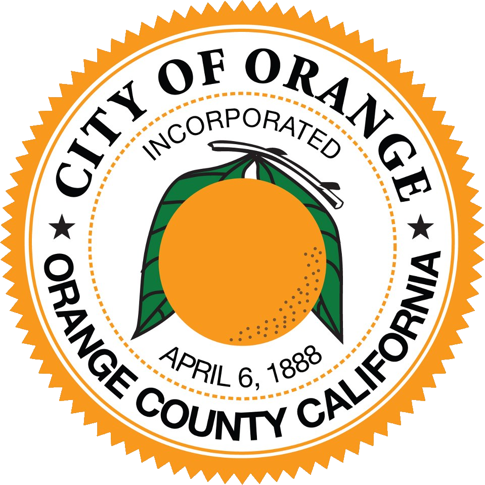 A circular logo with a jagged orange edge. Inside, the words "City of Orange" and "Orange County California" are written in a black serif font around the perimeter. The center features a detailed orange fruit with green leaves and a stem. Above the fruit,
